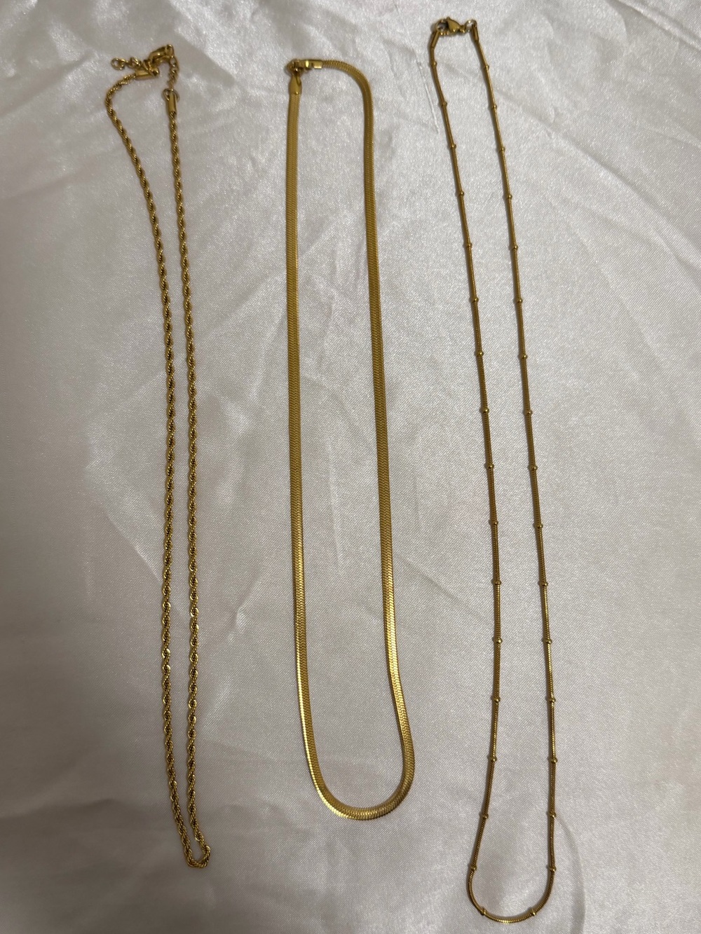 three (costume) gold necklaces!